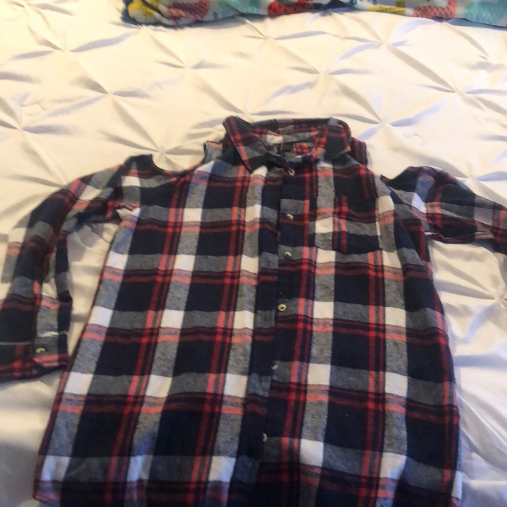 Plaid shirt with open shoulders.